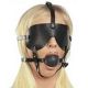 Black muzzle with a mask and a gag on the straps