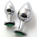 Metal anal plug under crystallized, a large green