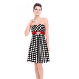 Black dress with white polka dots with a red belt strapless