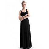 Long black dress to the floor with brooches on the straps