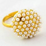 Golden ring with beads