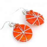 Earrings with orange round stones