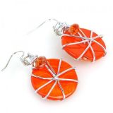 Earrings with orange, round stones