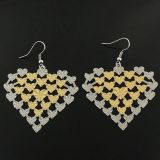 Two-tone earrings in the shape of a heart