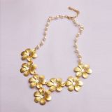 Gold necklace with flowers and pearls