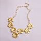 Gold necklace with flowers and pearls