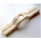 Wooden clamp for a scrotum