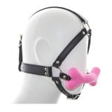 Black classic gag for the mouth in the form of pink silicone bone
