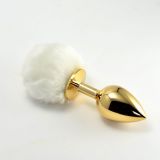 Golden anal toy with white pompom