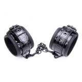 Black handcuffs made of crocodile skin